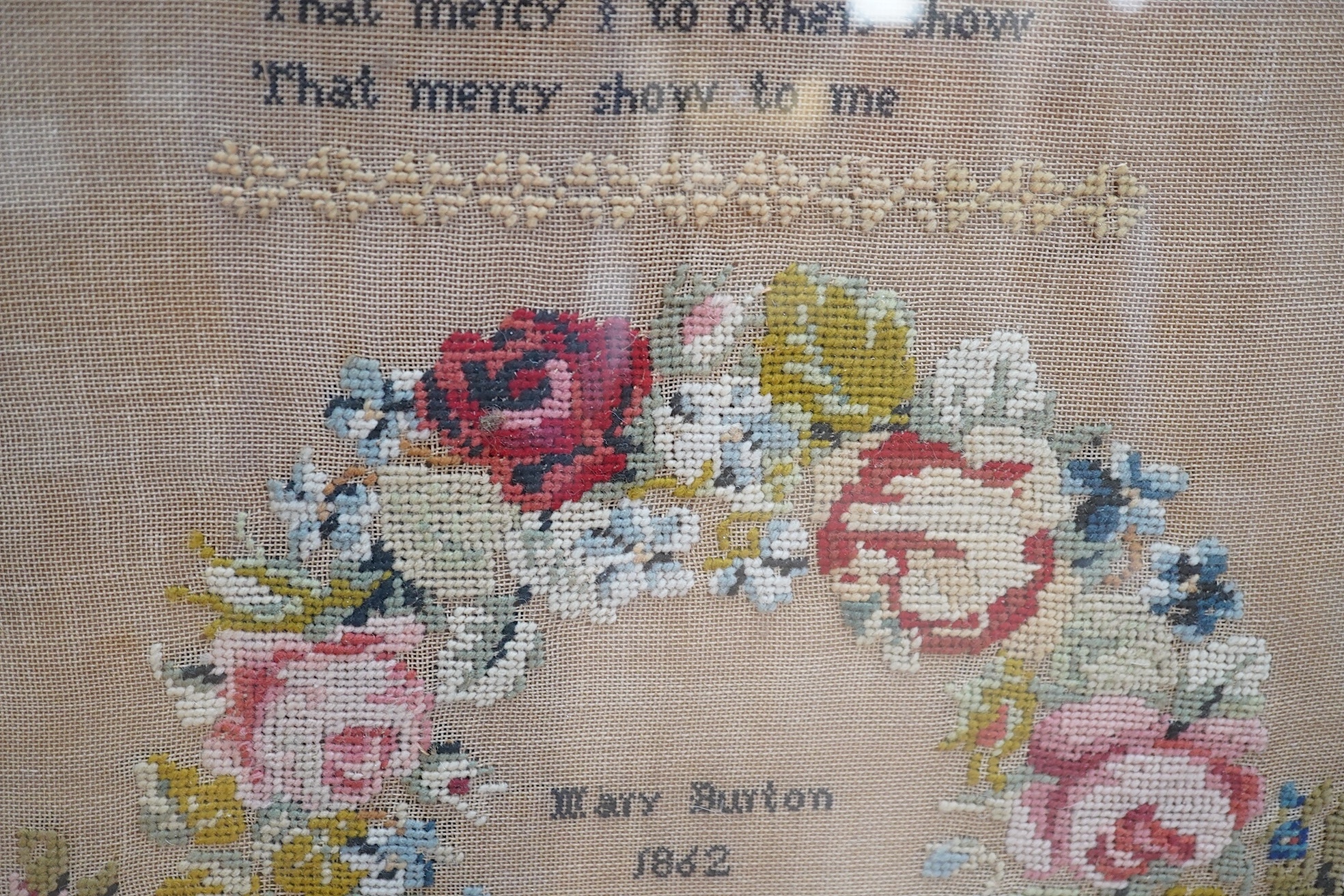 Two Victorian framed samplers; a large colourful floral sampler with short verse by Mary Burton 1862 and a smaller sampler by Julia Warner aged 13, dated 1846?, large 1862 sampler 59cm wide x 61cm high. Condition - large